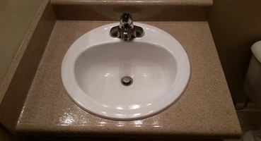 Read our frequently asked questions. The image shows a refinished bathroom sink.