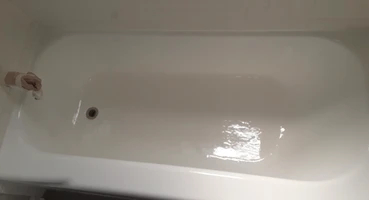Take a look at our project gallery. The image shows a refinished white bathtub.