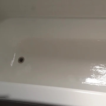 The image shows a refinished bathtub from above.